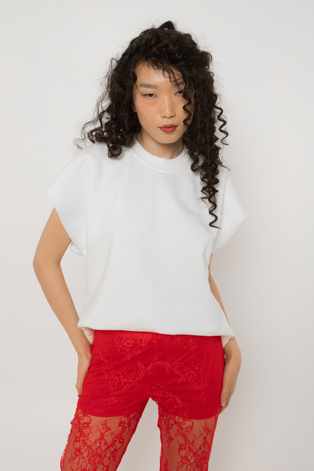 Red crystal tulle heart cutout across the back of the white oversized t-shirt