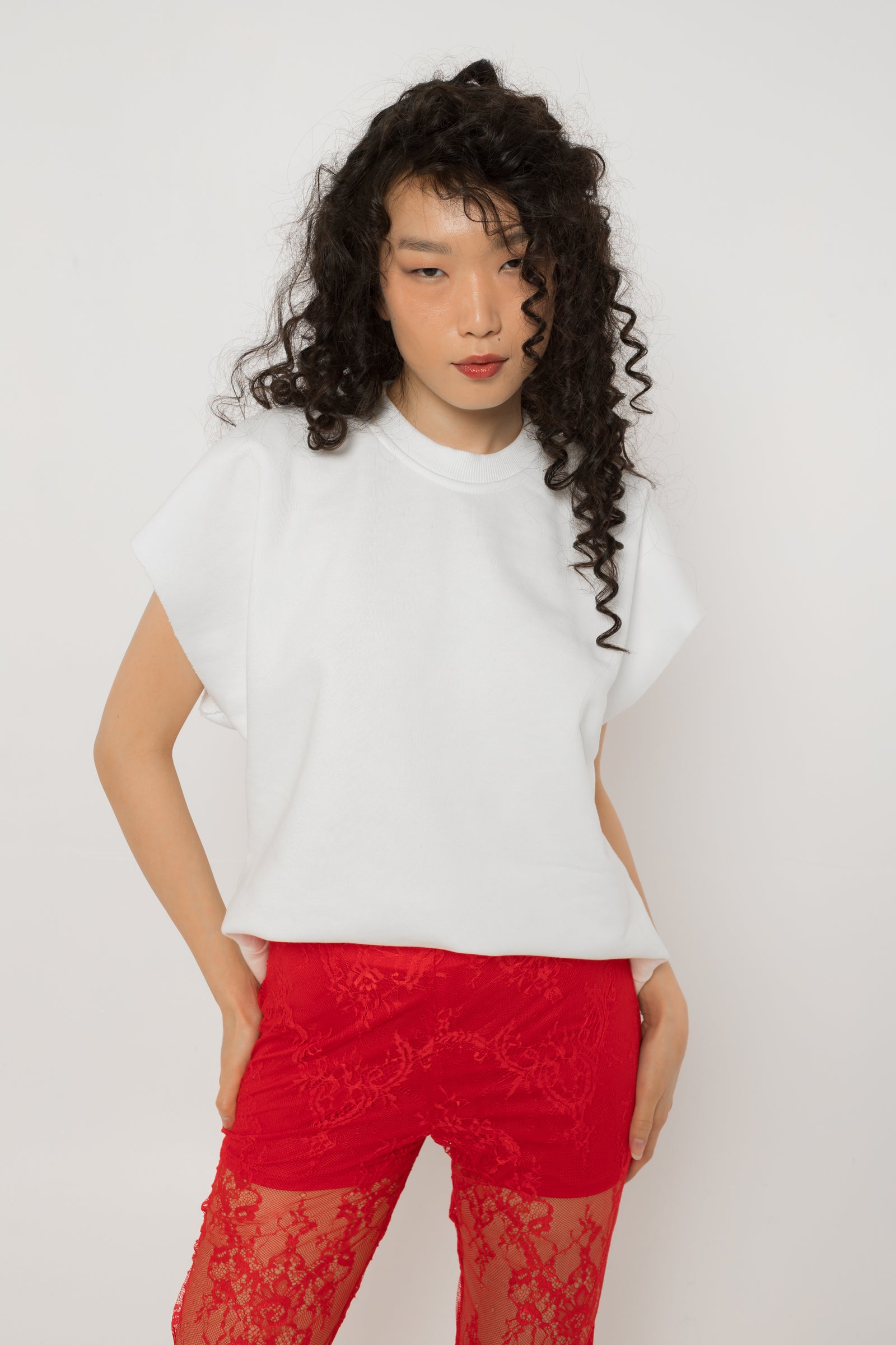 Red crystal tulle heart cutout across the back of the white oversized t-shirt
