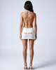 Back view of the Girl Code white ribbed halter mini dress showing fully open back and GIRL CODE pink logo print